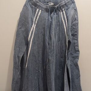 Denim skirt and match long sleeve crop top with hood. Split on both sides.